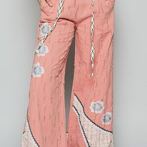 P195 POL floral patchwork relaxed fit pants in denim with embroidery detail.